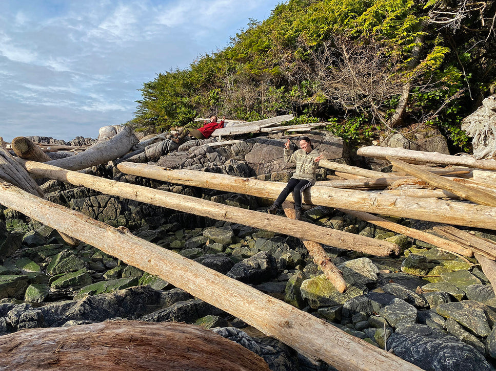 two people having fun on log beach